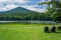 Older Couple Sitting by Abbott Lake Enjoying the View of Sharp Top Mountain